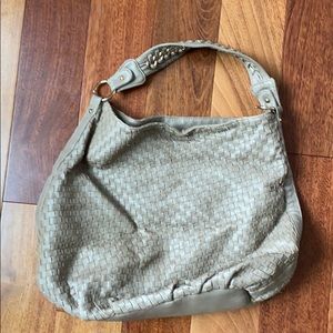 Worn but extremely durable DeuxLux handbag
